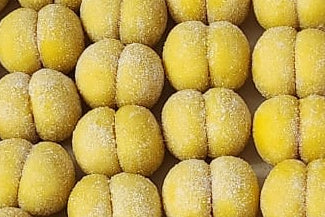 Close-up of yellow italian peach cookies lemon flavour with a textured surface